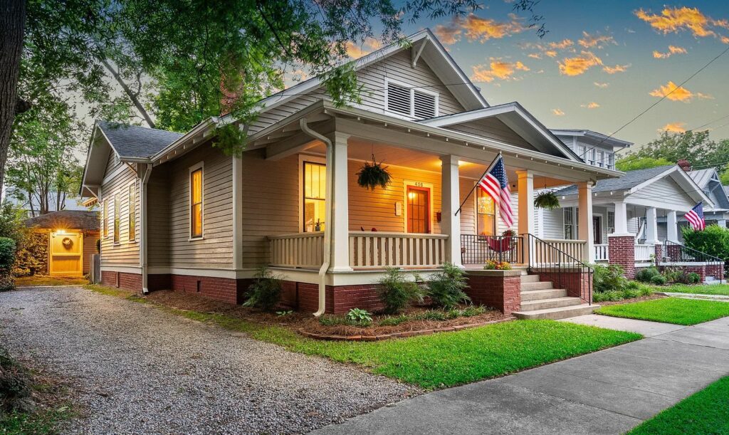 Picture of the Patrick House on 406 Student Street, showing it's front porch and driveway.